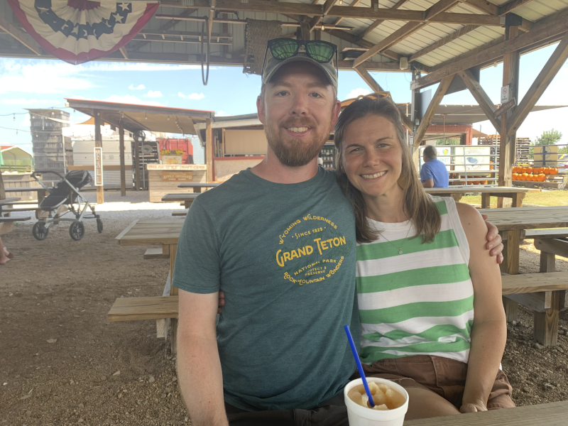 Enjoying Apple Cider at an Orchard